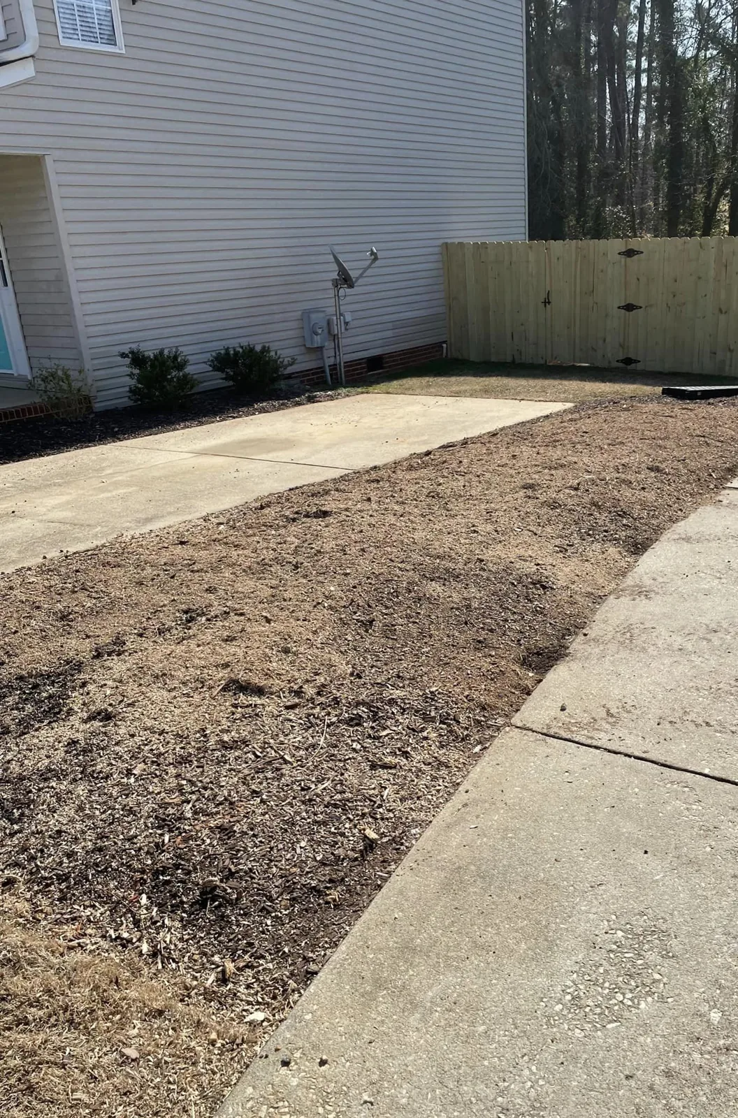 The same landscaped area cleared after stump grinding